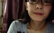 Nerdy young cock-lover takes her top off and teases the cam