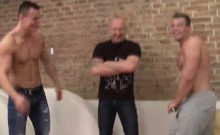 Two blokes and one strong daddy take turns and armwrestle